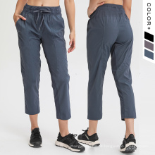 Neue Yogahose Frauen neunte Hosen mit Kordelkordel und Taschen Frau Sporthose Capri gewebt Febrik Kausal Kausaler Jogginghosen